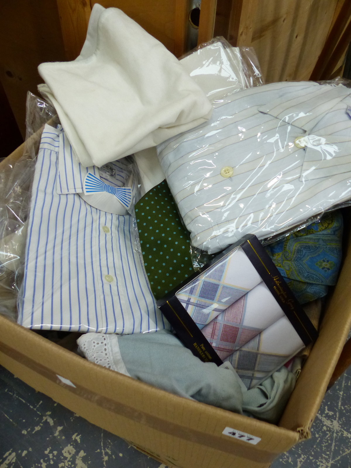 A QUANTITY OF UNUSED JAMES MEADE SHIRTS AND OTHER CLOTHING.