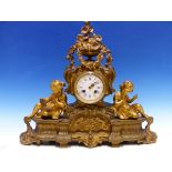 A VICTORIAN PARCEL GILT BRONZE CASED CLOCK COUNTWHEEL STRIKING ON A BELL, THE ENAMEL DIAL SURMOUNT