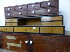 TWO ANTIQUE NESTS OF DRAWERS AND A SMALL CABINET.