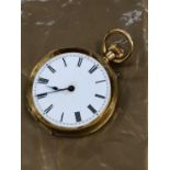 AN 18ct GOLD CONTINENTAL SMALL OPEN FACE POCKET WATCH.