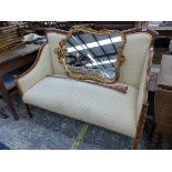 AN EDWARDIAN LINE INLAID MAHOGANY STAINED WOOD SHOW FRAME SETTEE UPHOLSTERED IN LEMON YELLOW. W