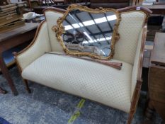 AN EDWARDIAN LINE INLAID MAHOGANY STAINED WOOD SHOW FRAME SETTEE UPHOLSTERED IN LEMON YELLOW. W