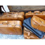 A COLLECTION OF TEN VARIOUS SIZE SUITCASES