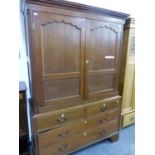 A GEORGE III OAK HANGING CUPBOARD WITH TWO DRAWER BASE ON BRACKET FEET.