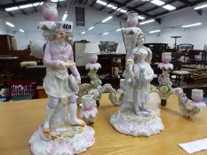 A PAIR OF PORCELAIN THREE BRANCH CANDELABRA WITH CROSS SWORD MARKS TO BASE.