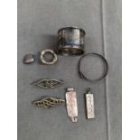 A HALLMARKED SILVER NAPKIN RING, A SILVER BROOCH SIGNED TT&CO, A 1977 SILVER INGOT, TWO CELTIC
