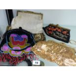 AN INTERESTING VINTAGE BEADWORK EVENING BAG, AN EMBROIDERED EXAMPLE AND THREE OTHERS.