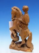 AN OLIVE WOOD CARVING OF A GREEK SOLDIER AND HIS HORSE REARING AS IT IS BITTEN BY A SNAKE. H 20.