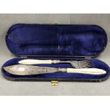 A PAIR OF VICTORIAN SILVER HALLMARKED SILVER CASED FISH SLICE AND FORK SERVERS, WITH IVORY