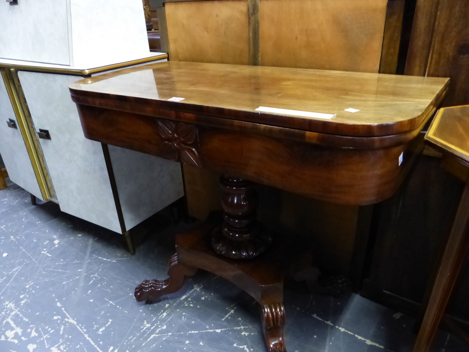 A 19th C. MAHOGANY SWIVEL TOP TEA TABLE ON TURNED COLUMN AND FOUR PAW FEET. W 94 x D 46 x H 76cms.