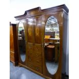 A LARGE EDWARDIAN INLAID COMPACTUM WARDROBE. W 192 X D 51 X H 217CMS.