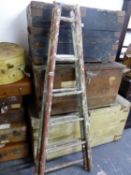 A RUSTIC A-FRAME PAINTED WOOD LADDER WITH SIX RUNGS ON ONE SIDE AND FIVE ON