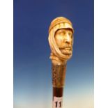 A CALAMANDER WOOD WALKING CANE WITH HALLMARKED SILVER PRESENTATION BAND AND IVORY HANDLE CARVED AS