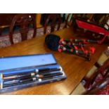 A BOXED SET OF EBONY BAGPIPES, THE BLACK VELVET BAG TRIMMED IN RED, FITTED WITH A CHANTER NAMED