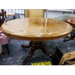 A VICTORIAN WALNUT QUARTER VENEERED OVAL TABLE EBONY LINE INLAID ABOUT FLORAL DIAMONDS SUPPORTED ON