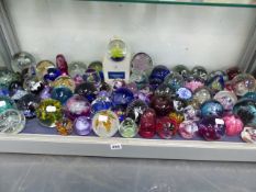 AN EXTENSIVE COLLECTION OF GLASS PAPERWEIGHTS