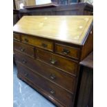 A GEORGIAN STYLE MAHOGANY BUREAU, THE FALL STAR INLAID ABOVE A CONFIGURATION OF SEVEN DRAWERS AND BR