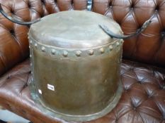 A VINTAGE COPPER COPPER MOUNTED ON THREE IRON STRAP LEGS. Dia. 53.5cms.