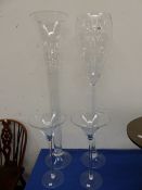 FOUR OVERSIZED DECORATIVE GLASSES.