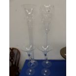 FOUR OVERSIZED DECORATIVE GLASSES.