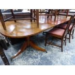 A MAHOGANY D-END DINING TABLE WITH SINGLE LEAF SUPPORTED ON TWO GUN BARREL COLUMNS AND TRIPODS