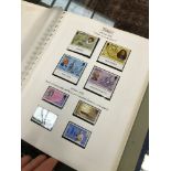 A LARGE COLLECTION OF STAMPS IN ALBUMS
