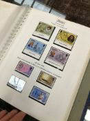 A LARGE COLLECTION OF STAMPS IN ALBUMS