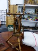 A TURNED MAHOGANY SPINNING WHEEL