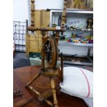 A TURNED MAHOGANY SPINNING WHEEL