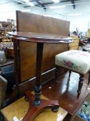 AN ANTIQUE MAHOGANY TABLE ON FLORAL SCRATCH CARVED COLUMN, THE TRIPARTITE BASE ON BUN FEET