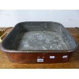 AN ANTIQUE SQUARE TINNED COPPER TWO HANDLED COOKING PAN. 43.5 x 43.5cms.