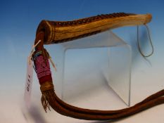 A BRASS STUDDED BONE HANDLE BEAD DECORATED LEATHER WHIP, POSSIBLY MAASAI