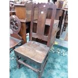 A 17th C. OAK CHAIR, THE WAVY TOP RAIL ABOVE A PLANK SPLAT INLAID WITH A ROUND ARCH TOPPED