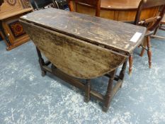 A GEORGE III OAK COTTAGE GATE LEG TABLE.