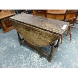 A GEORGE III OAK COTTAGE GATE LEG TABLE.