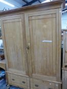 A LAE VICTORIAN ASH WARDROBE, WITH DOORS ENCLOSING HANGING SPACE ABOVE TWO DRAWERS. W 146 x D 41