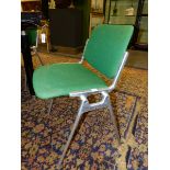 A SET OF SIX GIANCARLO PIRETTI FOR CASTELLI ALUMINIUM STACKING CHAIRS WITH GREEN UPHOLSTERED BACKS A