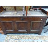 AN ANTIQUE OAK COFFER WITH THREE PANELLED LID AND FRONT. W 127 x D 53 x H 68cms.