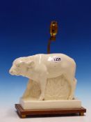 A WEDGWOOD JOHN SKEAPING WHITE GLAZED FIGURE OF A BISON MOUNTED ON A WOODEN PLINTH BACKED BY THE LAM