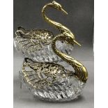 A PAIR OF HALLMARKED SILVER AND CUT GLASS SWAN FORM SALTS, WITH ARTICULATED GILDED WINGS DECORATED
