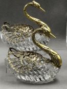 A PAIR OF HALLMARKED SILVER AND CUT GLASS SWAN FORM SALTS, WITH ARTICULATED GILDED WINGS DECORATED