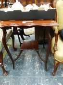 A MAHOGANY TWO TIER TABLE, THE SHAPED TOP ON CABRIOLE LEGS JOINED TO THE TIER BY CURVED BARS. W 62 x