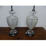 A PAIR OF CUT GLASS BALUSTER URN SHAPED TABLE LAMPS. H 55cms.