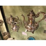 A VICTORIAN HALLMARKED SILVER FOUR PART COFFEE AND TEA SET. THE TEAPOT, SUGAR BOWL AND CREAMER DATED