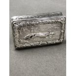 A VICTORIAN SILVER HALLMARKED SNUFF BOX, WITH RAISED RUNNING FOX DECORATION AMONGST A RURAL SCENE