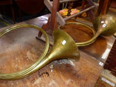 TWO BRASS HORNS.