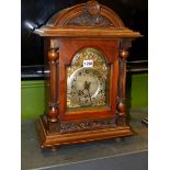 A MAHOGANY CASED WURTEMBERG MANTEL CLOCK, THE MOVEMENT STRIKING AND CHIMING ON FIVE RODS, PAPER