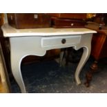 A COUNTRY FRENCH STYLE TABLE WITH SINGLE DRAWER ABOVE CABRIOLE LEGS. W 83 x D 59 x H 77cms.