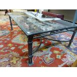 A GLASS TOPPED IRON RECTANGULAR COFFEE TABLE, THE UNDERTIER WROUGHT WITH SCROLLS, LEAVES AND