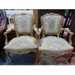 A PAIR OF FRENCH GILT WOOD FAUTEUILS, THE SHAPED SQUARE BACKS, ELBOW RESTS AND SEATS UPHOLSTERED